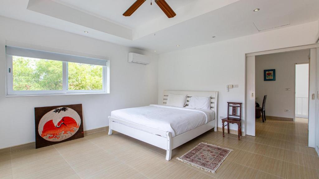 Tropical 4-bedroom Beachside villa with Rooftop Terrace in Hua Thanon for sale
